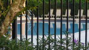 Metal fencing around a pool.